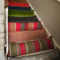 Llama Orange Draught Excluder Cushion -Andrew Martin 352679 draught excluder stair group shot sml