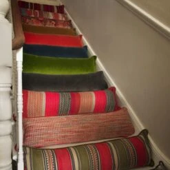 Medici Indigo Draught Excluder Cushion -Andrew Martin 353028 draught excluder stair group shot sml