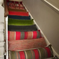 Medici Raw Umber Draught Excluder Cushion 10 Medici Raw Umber Draught Excluder Cushion -Andrew Martin 353167 draught excluder stair group shot sml