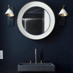 Cleo Wall Light -Andrew Martin 353875 cleo sconce in bronze and antique burnished brass with matte white shade lifestyle